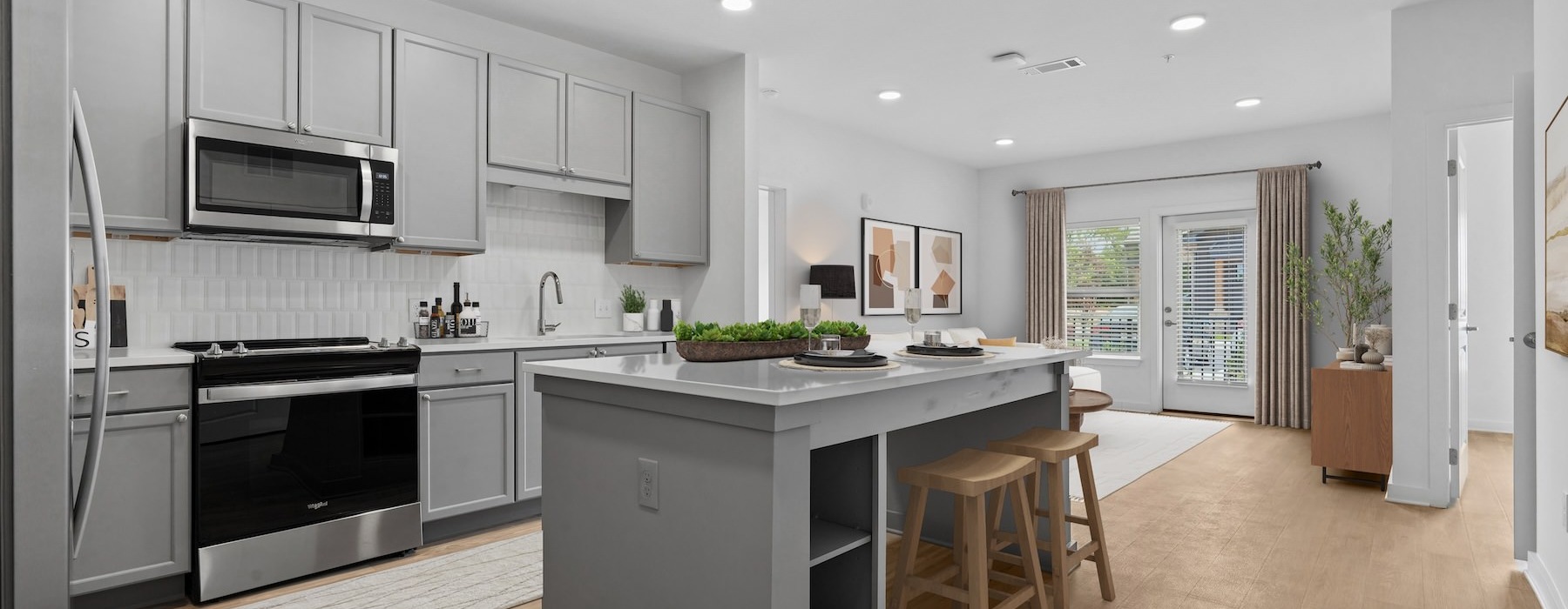 a kitchen with grey cabinets