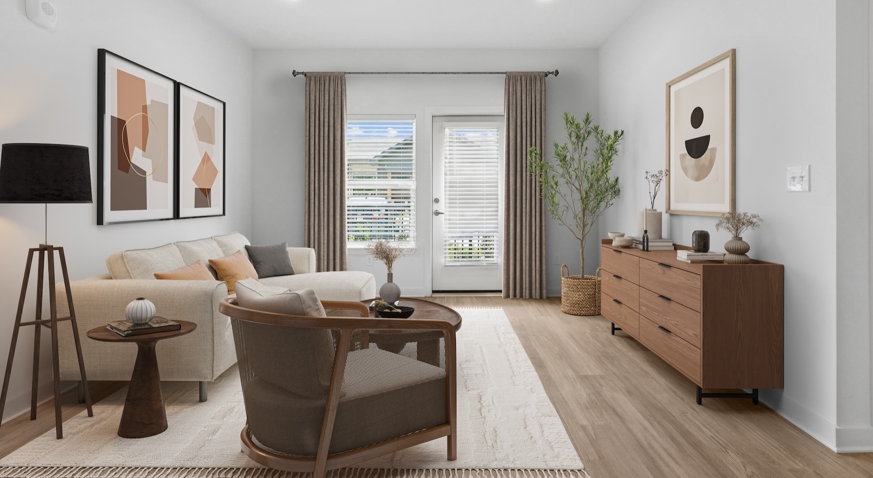 a living room with a couch, chair and tables