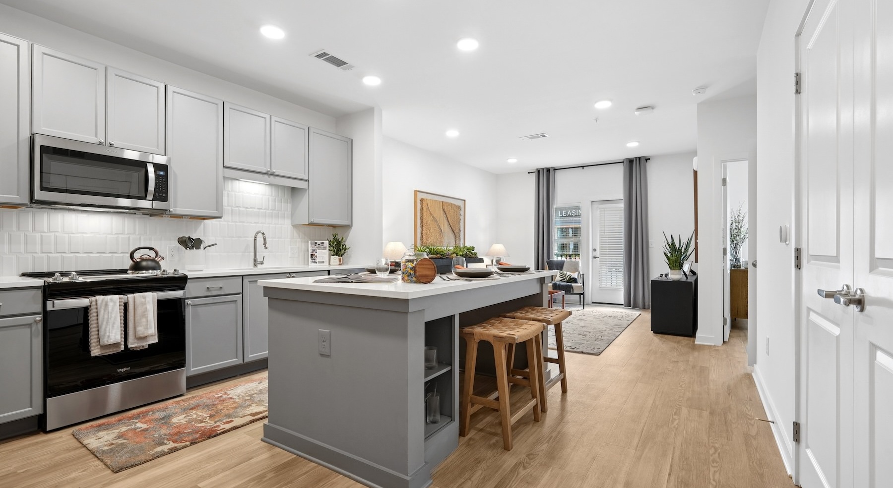 a kitchen with grey cabinets