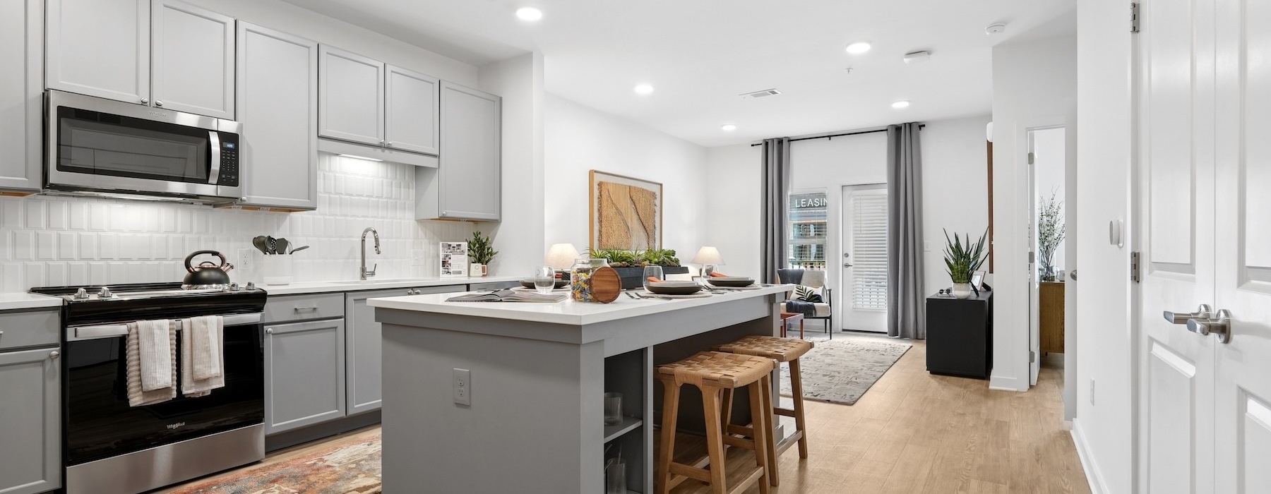 a kitchen with grey cabinets