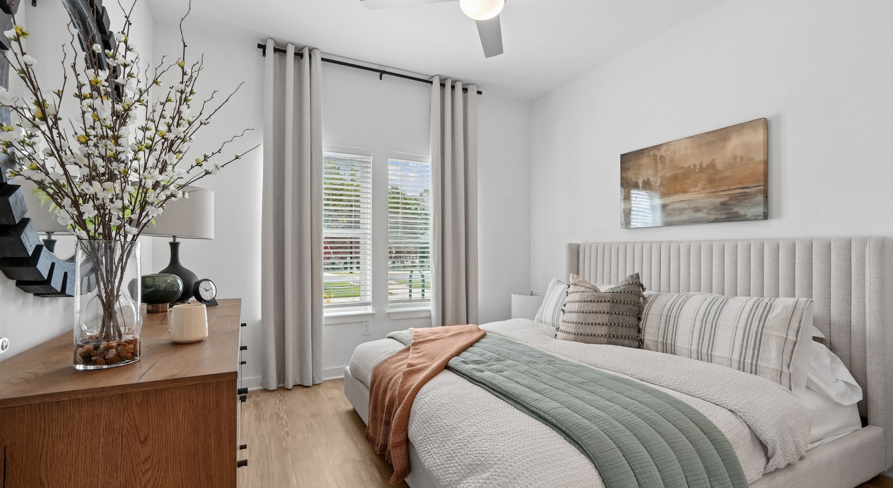 a bedroom with a bed and a dresser